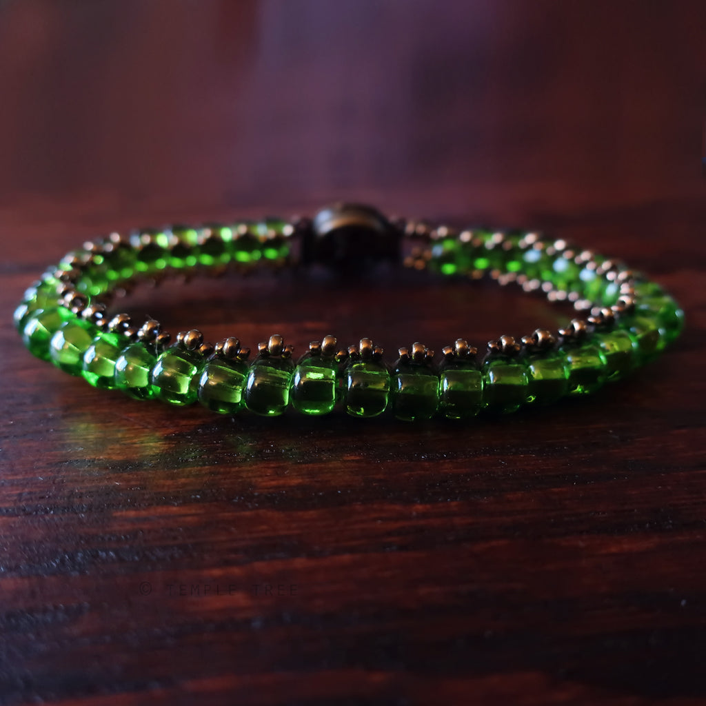 Temple Tree Boho Glass Bead Caterpillar Weave Bracelet - Green and Bronze