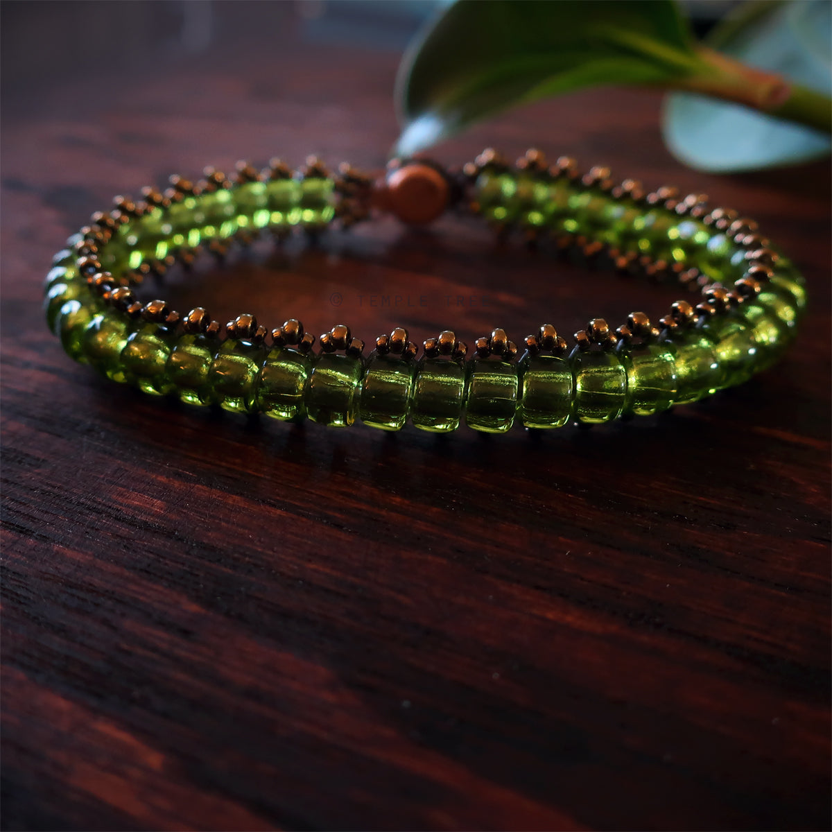 Temple Tree Boho Glass Bead Caterpillar Weave Bracelet - Peridot Green and Bronze